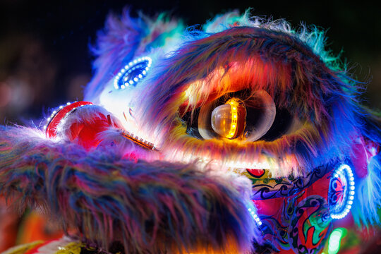 Surabaya, Java Timur, Indonesia - May 16, 2026 - A dancing lion head costume, colorful and with decorative lighting, at the Surabaya Vaganza 2026 nighttime parade in Surabaya