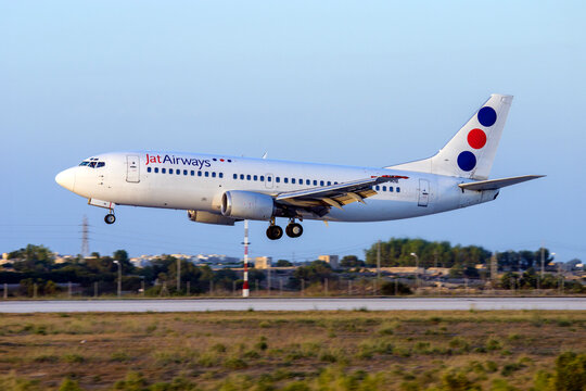 Luqa, Malta - July 12, 2007: JAT Airways Boeing 737-3H9 (REG: YU-ANI) landing runway 32.