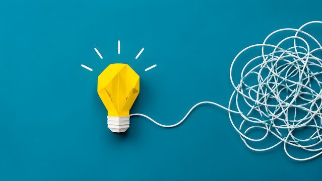 Conceptual papercraft art of a yellow origami lightbulb connected to a tangled string untangling into a clear idea symbolizing business problem solving