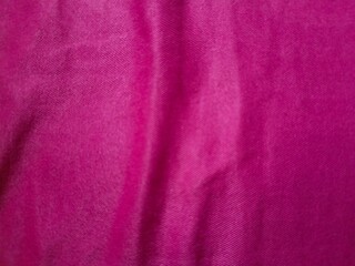 Close up view of soft bright pink magenta velvet fabric texture background. © ABD