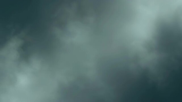 Abstract smoky texture background in dark teal and light grey tones.