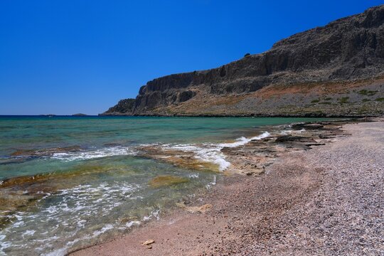 Rhodes island vacation in Greece. Navarone Bay beach landscape in sunny weather in Lindos.