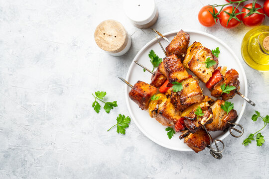 Grilled shish kebab or meat skewers with vegetables.