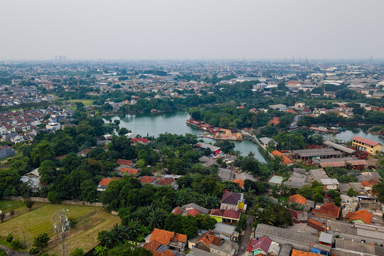 Hazy cityscape of Bekasi, Indonesia showing heavy air pollution and urban sprawl