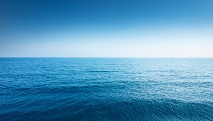 Fototapeta premium Calm Blue Ocean With Gentle Waves Horizon Fades Into White Sky Minimalist And Peaceful Scene