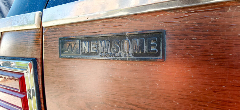 Saint Petersburg, Russia - May 23, 2026: Pontiac Parisienne Marauder emblem on a vintage car with wood paneling and chrome accents, showcasing classic automotive design details