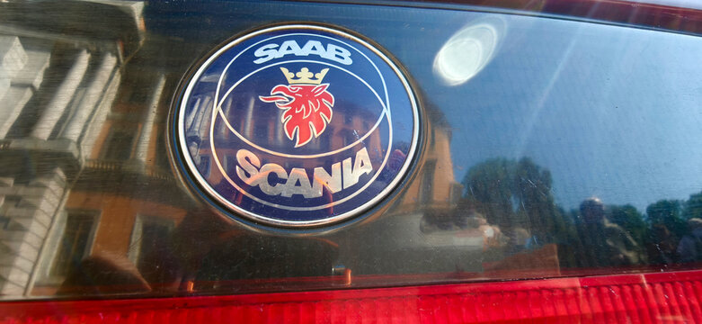 Saint Petersburg, Russia - May 23, 2026: Close-up of a Saab Scania logo on a car, showcasing the iconic red lion emblem and brand name against a reflective surface