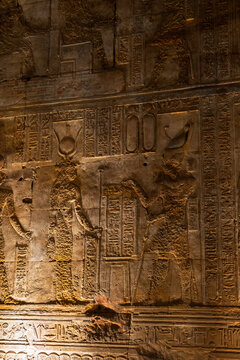 Epic ancient Egypt stone wall hieroglyphics texture background carved relief pattern.
