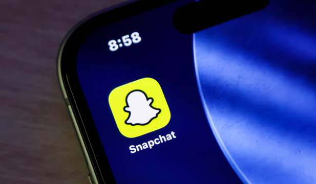 Closeup of the snapchat application icon on a smartphone screen