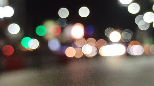 Artistic blur and refocused view of a crowded downtown street, capturing urban movement, city lights, and dynamic metropolitan atmosphere.