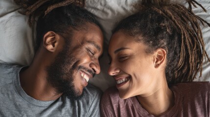 Obraz premium A happy couple in love communicate face-to-face while relaxing in bed.
