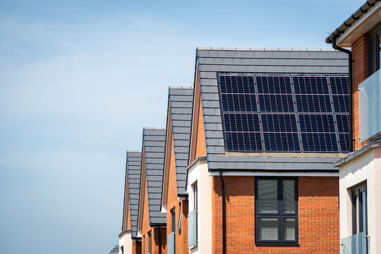 Photovoltaic solar panels on the roof of new built house in england uk. The concept of a sustainable environment, construction.