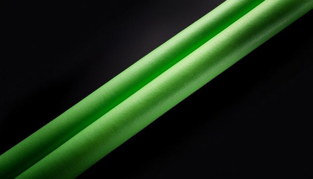 two green foam pool noodles diagonally on a plain black background isolated on white background