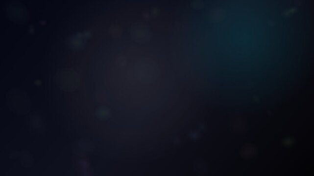 Subtle bokeh light particles floating on a dark blue background
