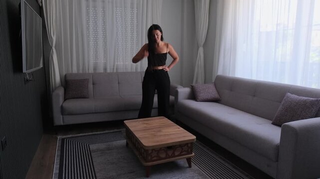 Mental overload and anxiety concept with restless woman pacing alone in modern apartment living room, overthinking and emotional stress