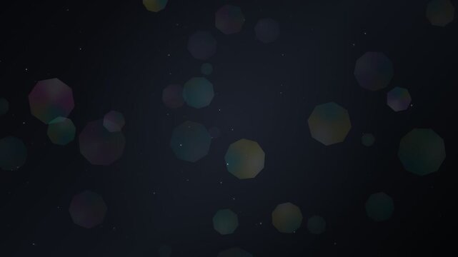 Floating octagonal bokeh particles on dark background