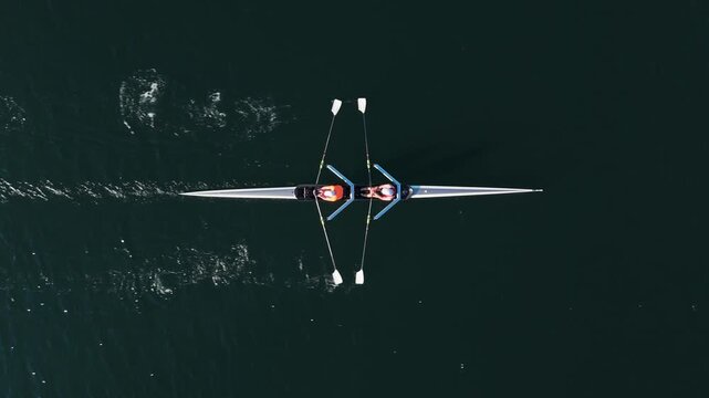 Experience the excitement as two skilled men navigate their rowing boat through the beautiful Halifax Ocean Bay. A thrilling display of teamwork and athleticism in Nova Scotia