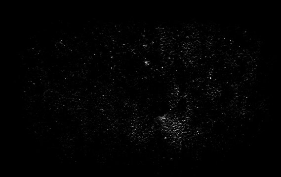 Moody dark textured background with subtle white spots and soft grunge noise creating aged vintage aesthetic for artistic digital image manipulation and composition work.