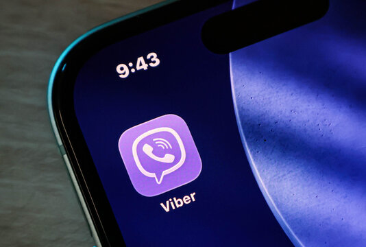 Closeup of the viber app icon on a smartphone screen, displaying the messaging and calling application logo on a modern mobile device display