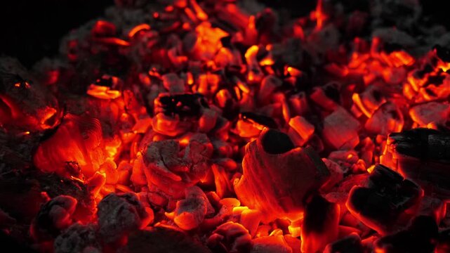 Glowing coals and embers, showcasing the beauty of lingering fire.