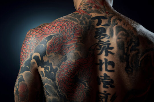 Dramatic shot of a full back tattoo in Japanese style, dragon and waves composition, rich black and red ink, strong directional studio lighting