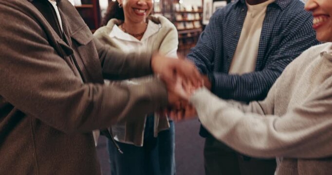 Library, stack hands and team of students with success, support and clap for college education. Group, pile and people together in university for applause, goal celebration or motivation for learning