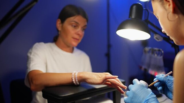 Communication during a manicure in a beauty salon as a separate type of relaxation. High quality 4k footage