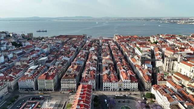 Drone Pullback from Commerce Square to Rossio and Jacaranda Trees in Lisbon