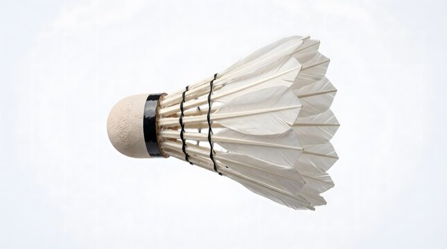A single badminton shuttlecock isolated on a clean white background