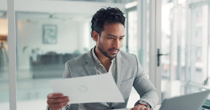 Laptop, reading paperwork and business man in office for accounting, data entry or budget. Computer, document and serious bookkeeper at work for financial report, audit analysis and investment review
