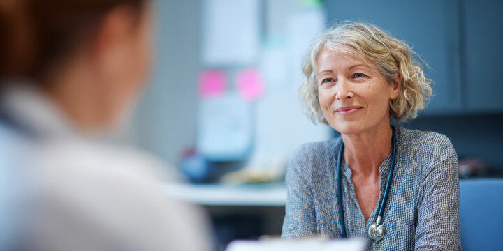 Female doctor consulting patient in