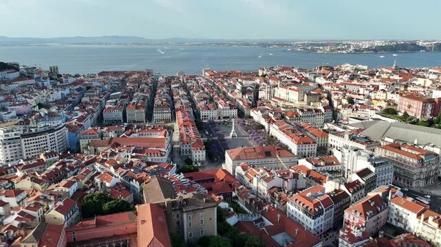 Drone Orbit Around Rossio Square and Jacaranda Trees in Lisbon