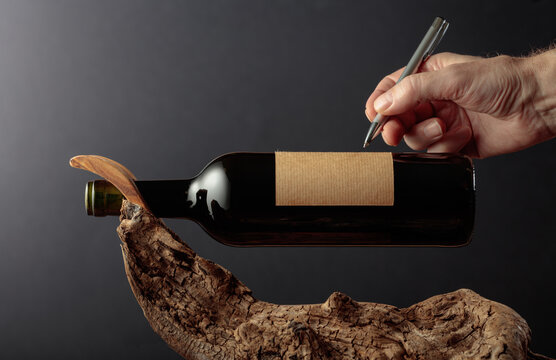 Bottle of red wine with empty label.