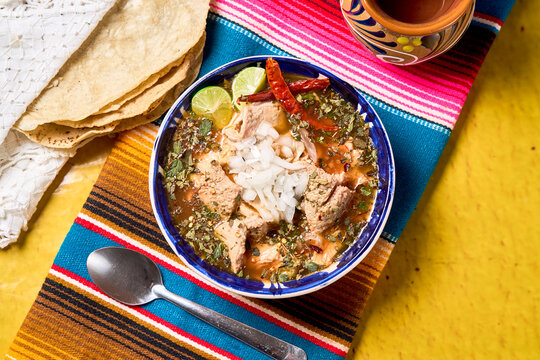 Authentic Mexican tripe soup menudo or mondongo served in a clay bowl.