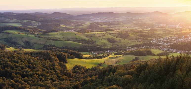 View of the Odenwald from the drum tower in Rimbach. The villages of Zotzenbach and M&ouml;rlenbach. Forest, meadows, fields. Sunset. Panorama. Rimbach, Bergstrasse district, Odenwald, Hesse, Germany