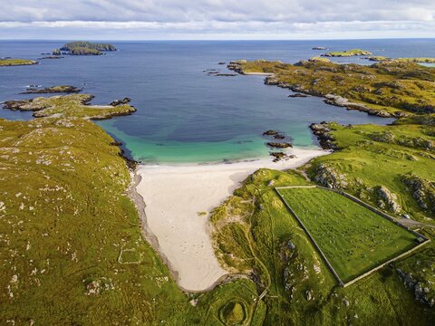 Aerial of white sand and turquoise water at Bosta Beach, Isle of Lewis, Outer Hebrides, Scotland, UK