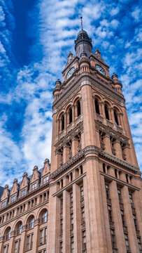 Milwaukee City Hall clock tower standing tall with historic architecture and blue sky