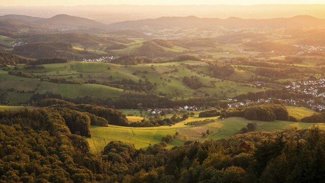 View of the Odenwald from the drum tower in Rimbach. The villages of Zotzenbach and M&ouml;rlenbach. Forest, meadows, fields. Sunset. Rimbach, Bergstrasse district, Odenwald, Hesse, Germany
