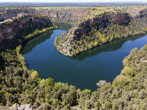 Expansive view of a river winding through deep gorges and a mountainous landscape, aerial view, gorge, Natural Park of the Gorges of the Durat&oacute;n River, Duraton, Parque Natural de las Hoces del R&iacute;o Durat&oacute;n, Sepulveda, Segovia, Valladolid, Castilla y Le&oacute;n, Spain
