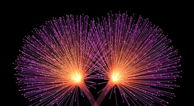 Glowing fiber optic strands resembling blooming flowers. Digital technology concepts and abstract light art. Artificial plant illuminating a dark black background.