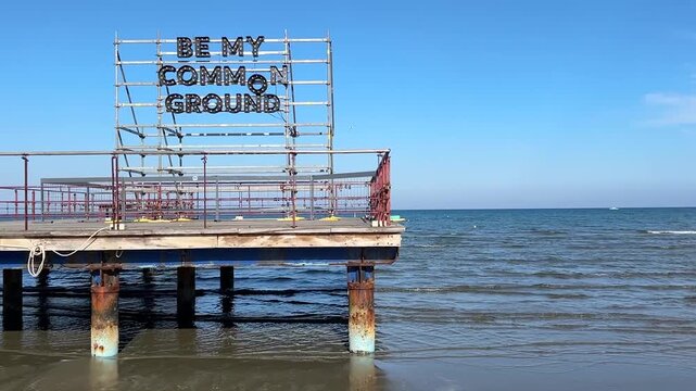 Phinikoudes embankment Larnaca Cyprus. Photo zone at the resort, anchor and letters Be my common ground
