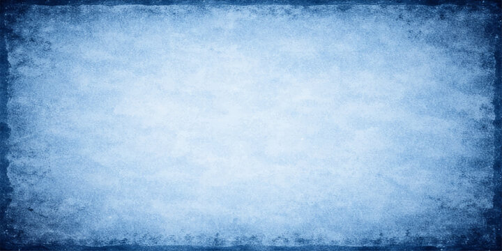 An abstract grunge blue background with a frame features a frozen white winter frost texture and snowflake patterns like cold ice on a cloudy summer sky