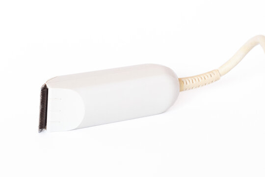 Compact electric sideburn trimmer isolated on a white background. Tool for shaping sideburns and beards