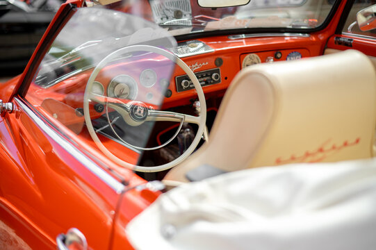 Tykocin, Poland &ndash; May 10, 2025: Interior of a classic Volkswagen Karmann Ghia convertible at a vintage car exhibition. Steering wheel, dashboard, and elegant cabin details.
