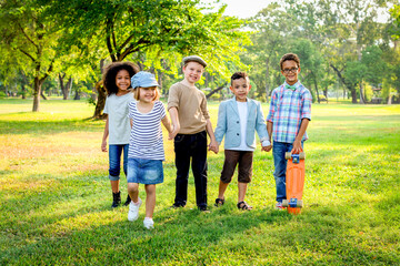 Fototapeta premium Happy kids playing in park