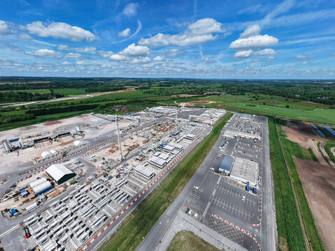Aerial view of the HS2 Concrete Segment Manufacturing and Production Site with rows of precast components and industrial machinery in Birmingham, England, United Kingdom.