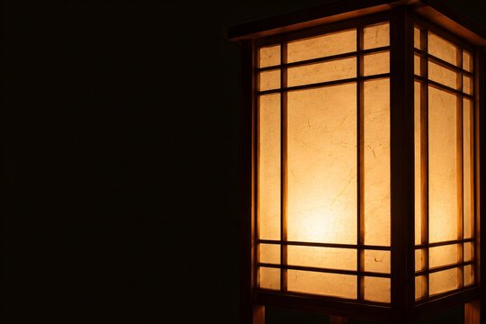 Traditional Japanese Andon Lantern with Warm Light and Dark Copy Space