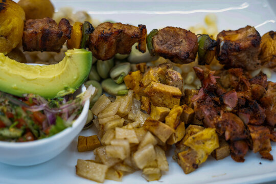 Peruvian anticucho skewers with grilled meat and avocado