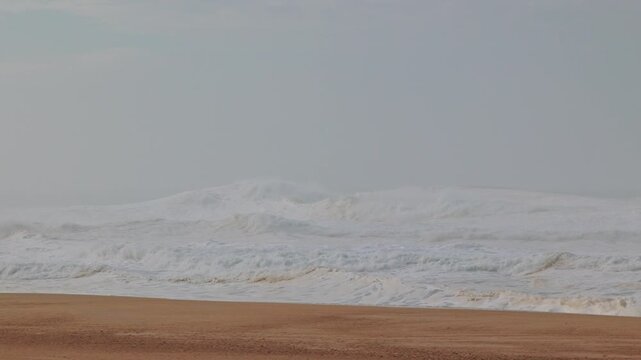 Big waves crushing in winter season in Nazare, Portugal