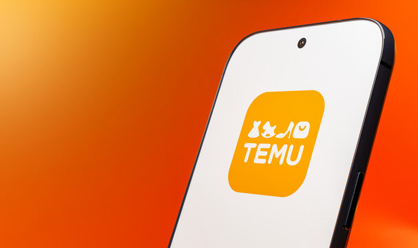 Smartphone Displaying Temu App Logo on Orange Background, 3D Rendered	